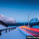 노르웨이 교통 사고 및 안전 대책 - **Prompt:** A serene, slightly snowy Norwegian mountain road at dusk. The road is impeccably maintai...